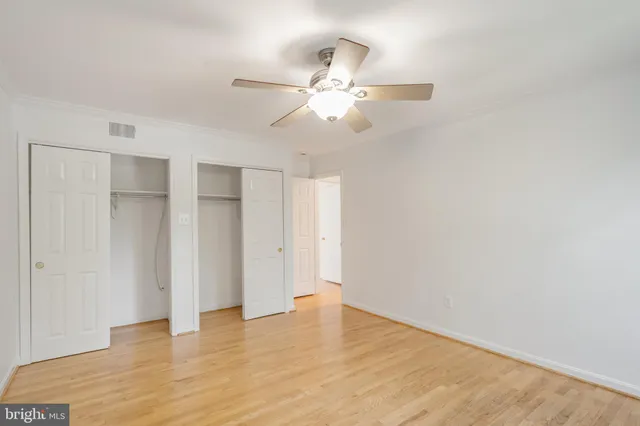 a bathroom with a double vanity sink toilet mirror and shower