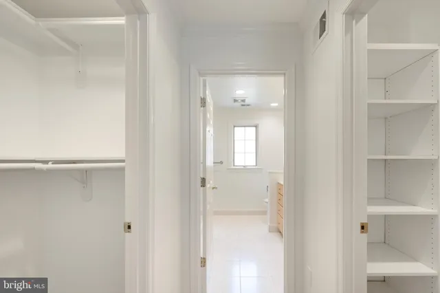 a bathroom with a sink a vanity and a large mirror
