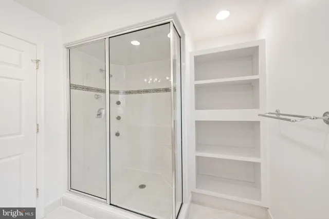 an empty room with a fireplace