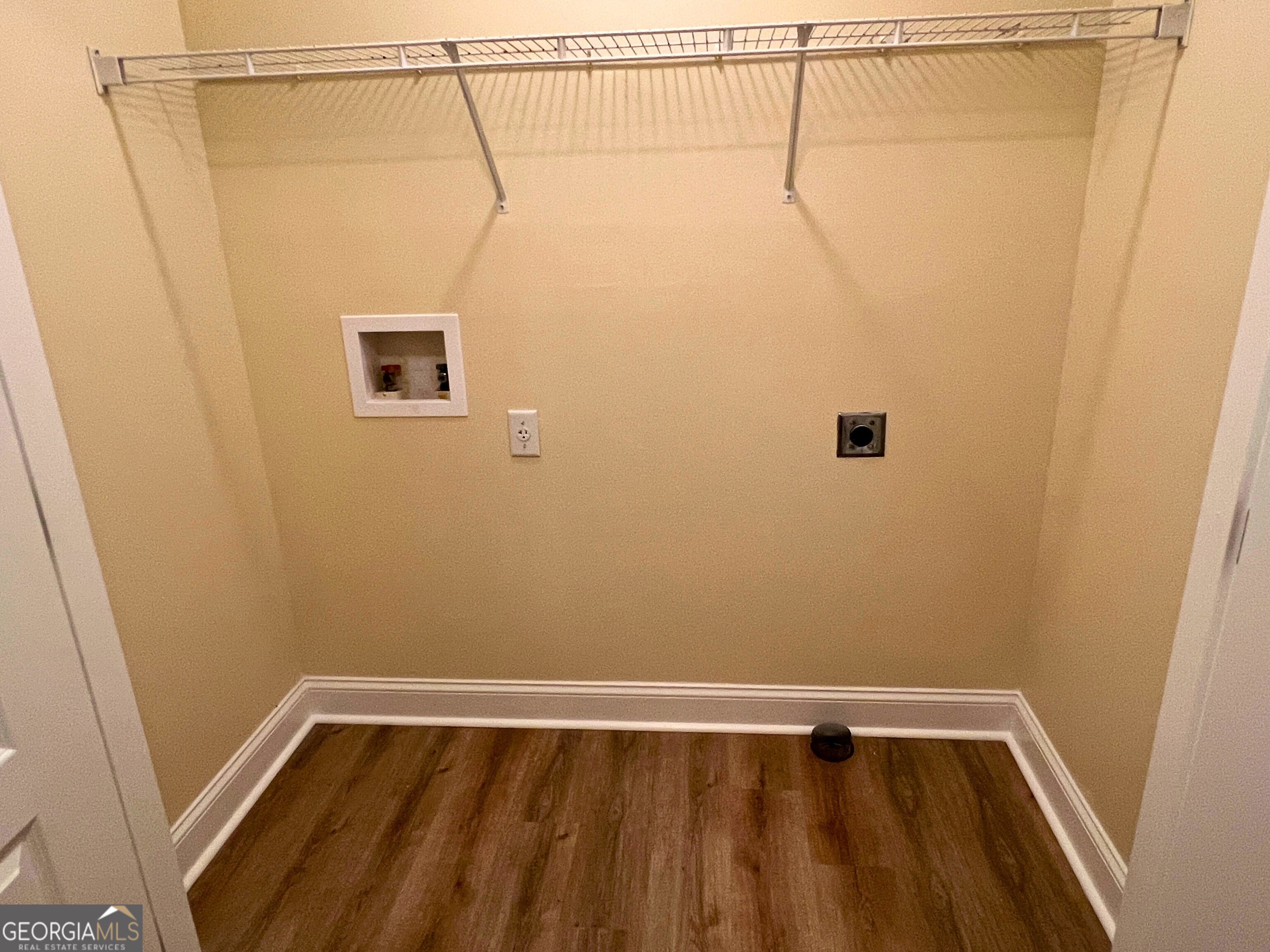 822 Davis Avenue Kingsland, GA 31548 - Photo 14 of 24 a view of a room with wooden floor and small window