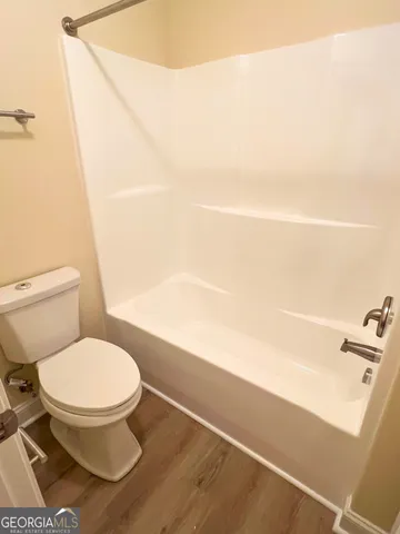 a bathroom with a toilet and a sink