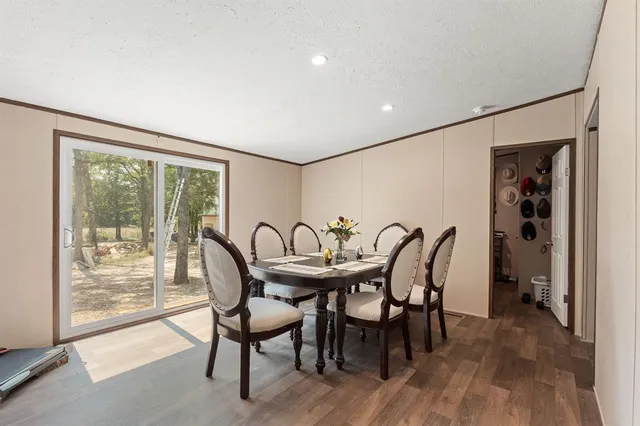 a dining room with furniture and window