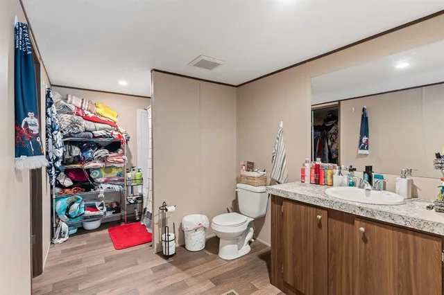 a bathroom with a sink mirror and vanity