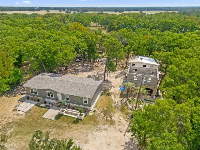 a aerial view of a house with swimming pool