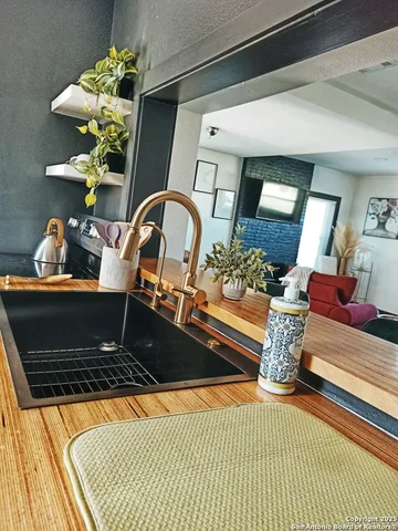 a large bed sitting in a bedroom next to a window