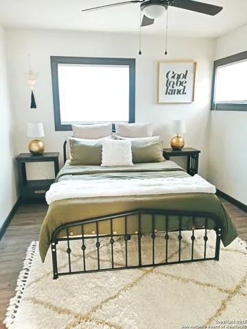 a bedroom with a bed and a table in it