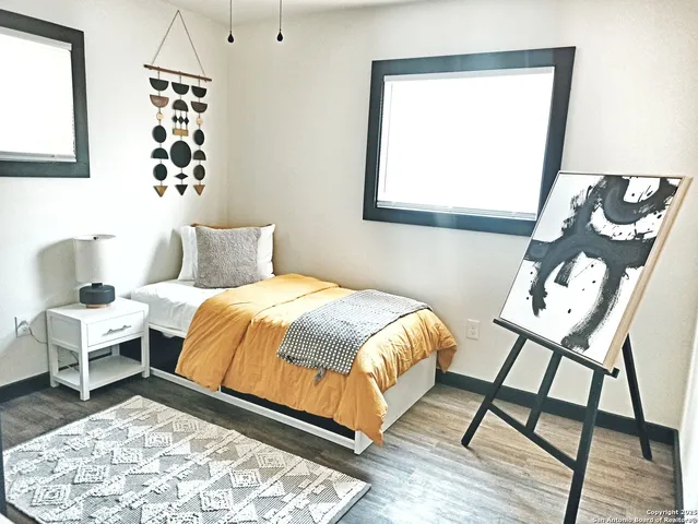 a view of an entryway with wooden floor