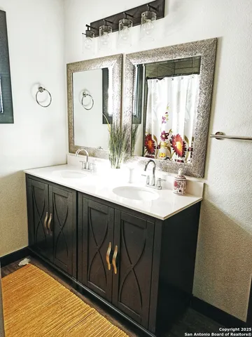 a bathroom with a sink and a mirror