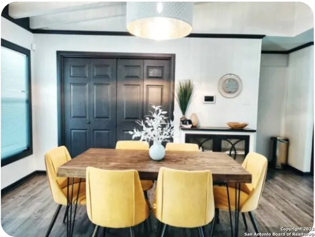 a kitchen with stainless steel appliances granite countertop a refrigerator sink stove and cabinets