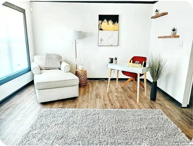 a bathroom with a sink mirror and a toilet