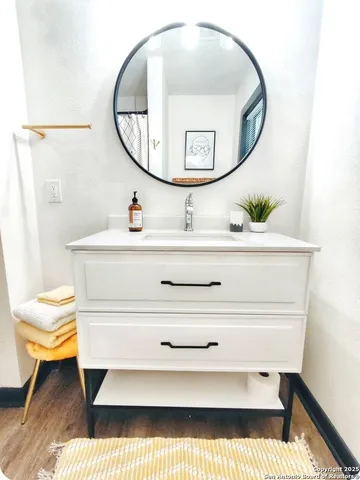 a bedroom with a bed couch and a window
