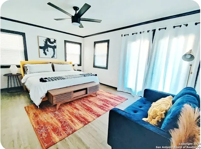 a bedroom with bed and a window