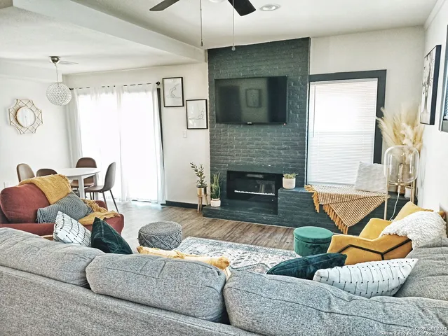 a living room with furniture and a fireplace