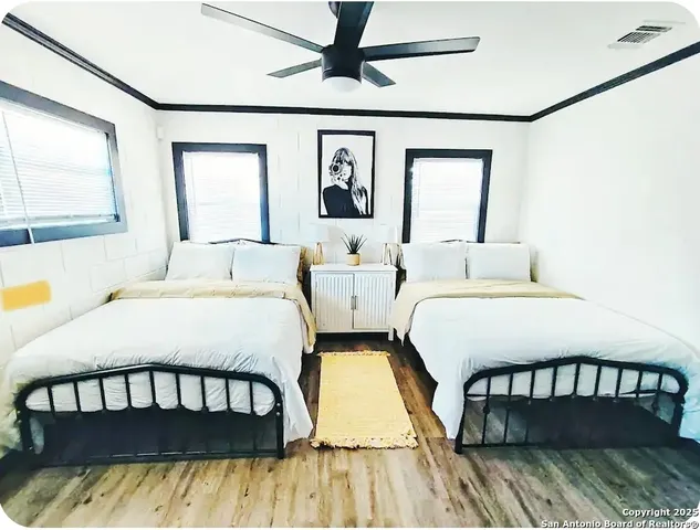 a kitchen with a sink and a painting