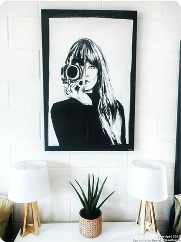 a dining room with furniture and a large window