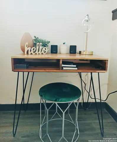 a kitchen with a dining table chairs and window