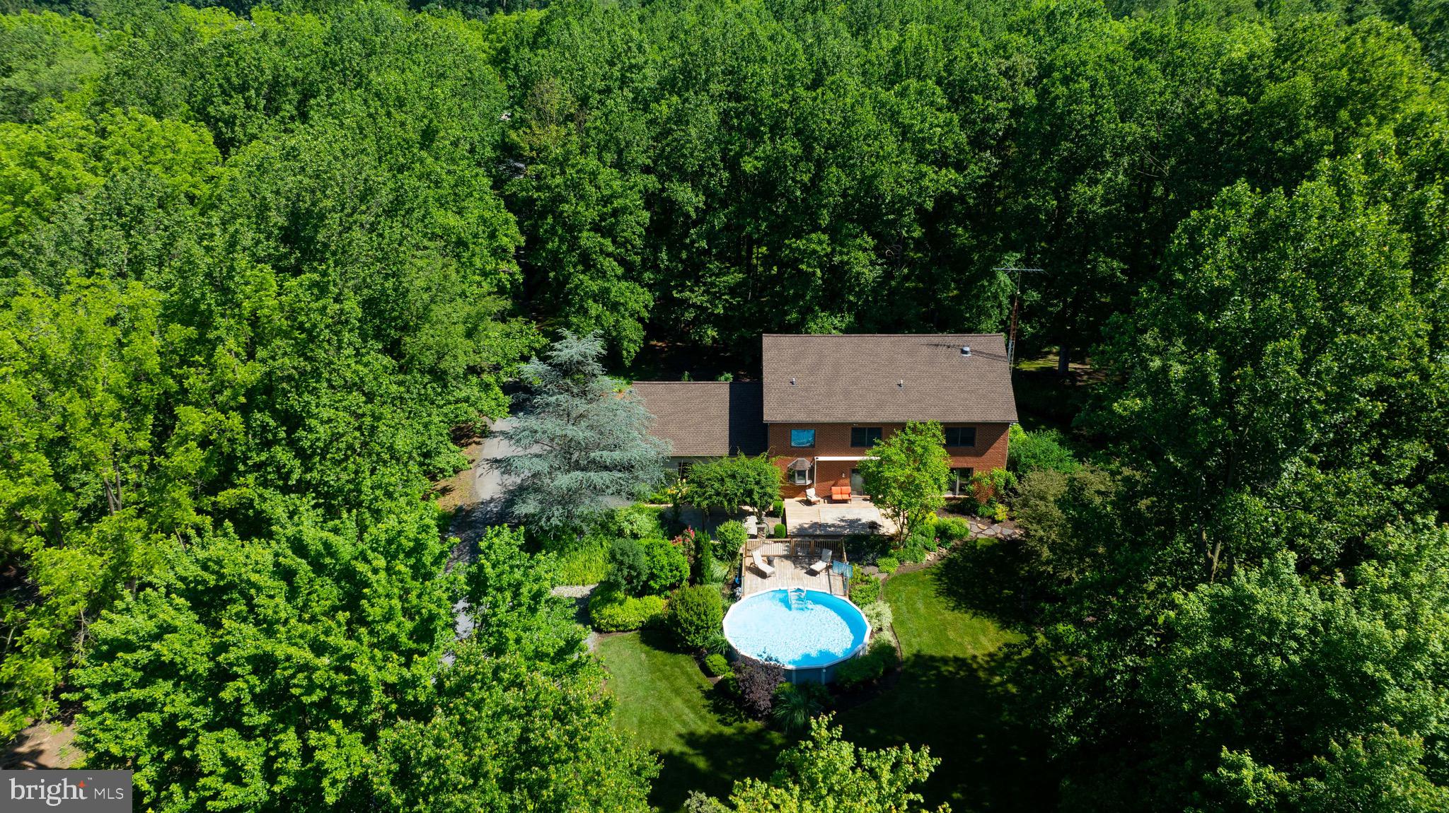 575 Church Road Manheim, PA 17545 - Photo 2 of 96 a view of a house with a back yard and a forest