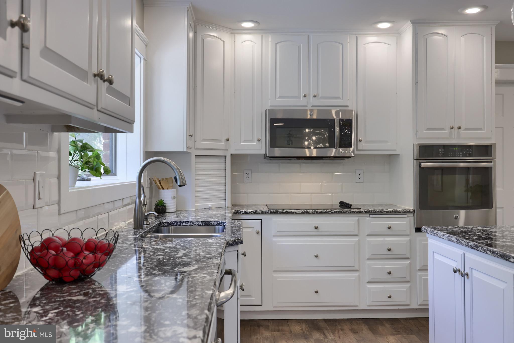 575 Church Road Manheim, PA 17545 - Photo 23 of 96 a kitchen with stainless steel appliances granite countertop a stove a sink and a microwave