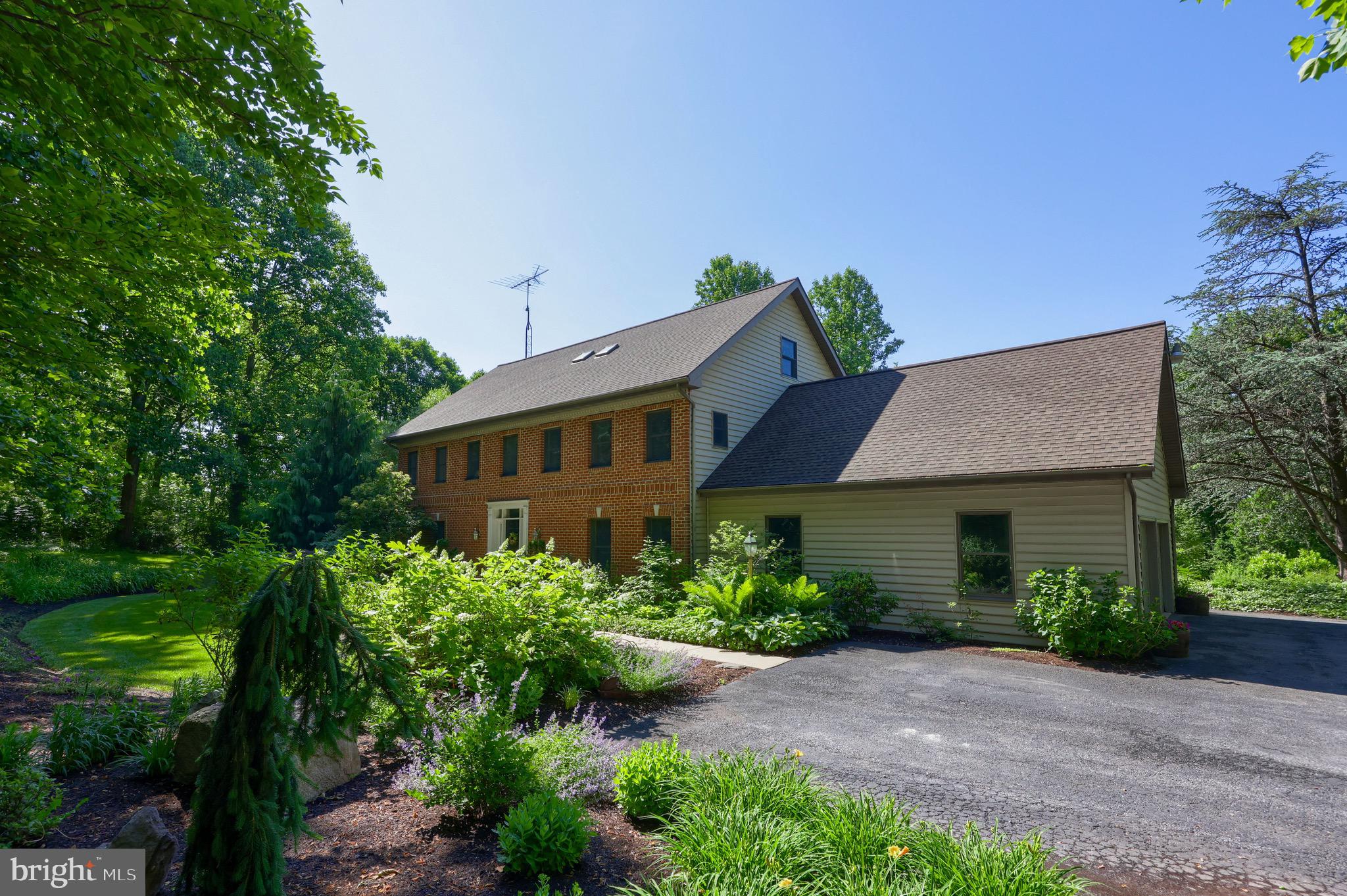575 Church Road Manheim, PA 17545 - Photo 6 of 96 a house view with a garden space