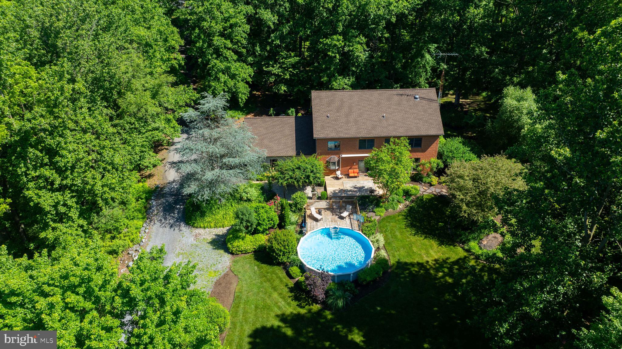 575 Church Road Manheim, PA 17545 - Photo 76 of 96 a view of a house with a swimming pool and garden