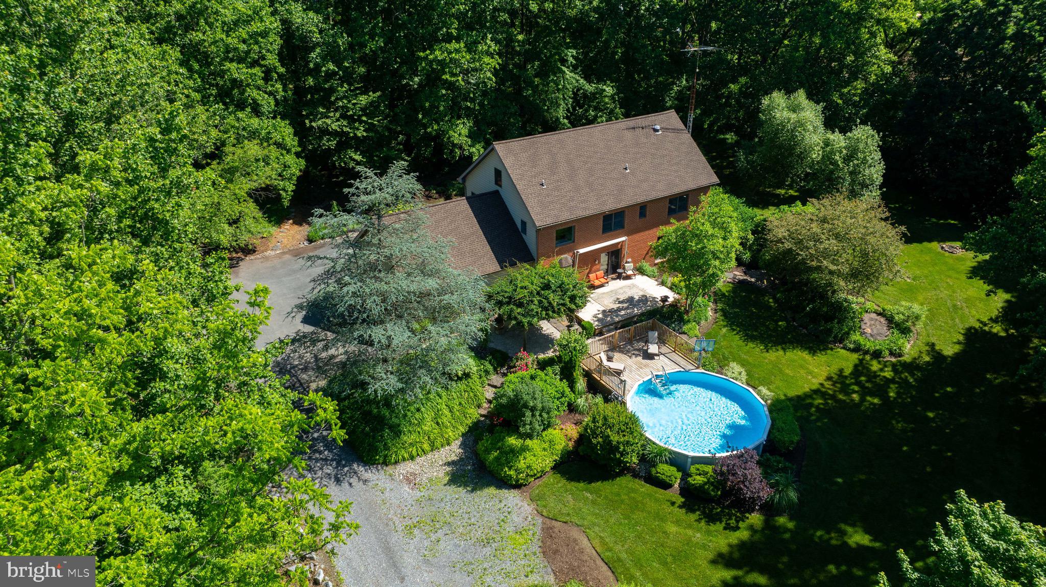 575 Church Road Manheim, PA 17545 - Photo 77 of 96 an aerial view of a house with a swimming pool outdoor seating and entertaining space