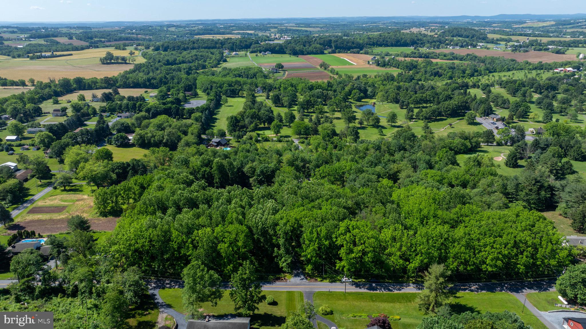 575 Church Road Manheim, PA 17545 - Photo 90 of 96 an aerial view of a houses with a yard and lake view