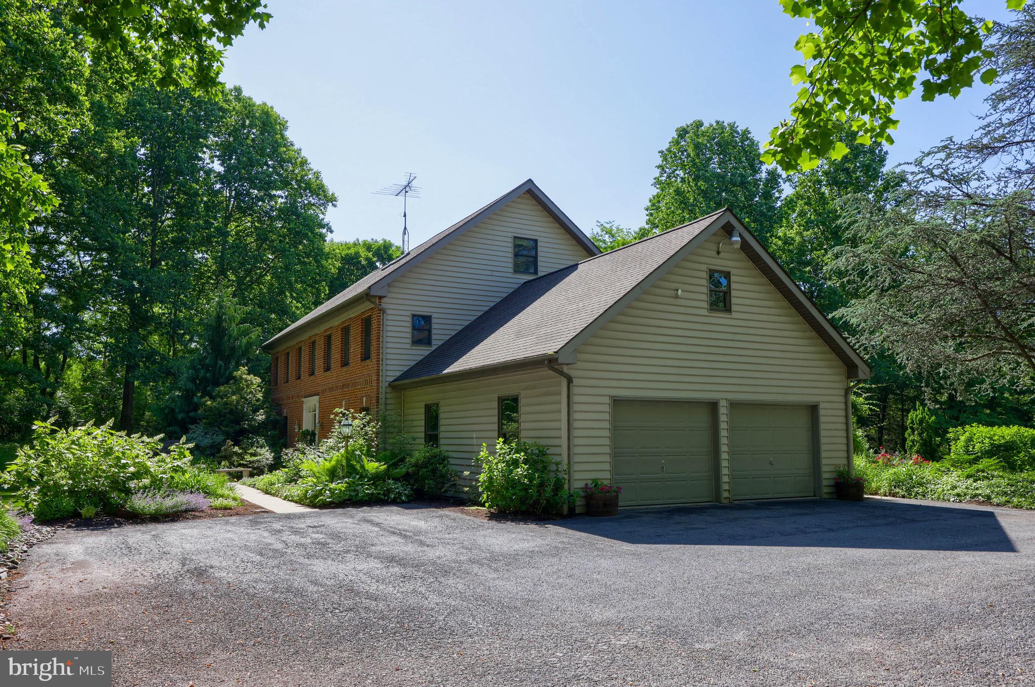 575 Church Road Manheim, PA 17545 - Photo 10 of 96 a front view of a house with a yard and trees