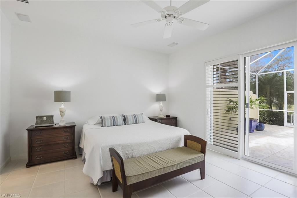 4080 Trinidad Way Naples, FL 34119 - Photo 13 of 35 a bedroom with a bed and a window