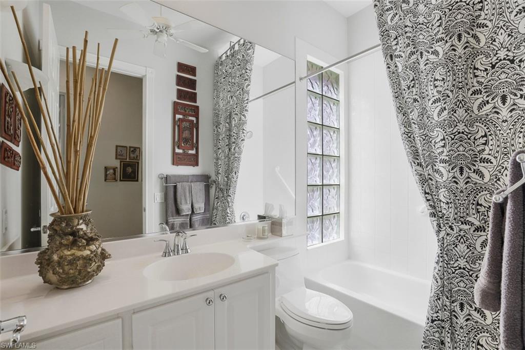 4080 Trinidad Way Naples, FL 34119 - Photo 17 of 35 a bathroom with a sink a toilet and a tub