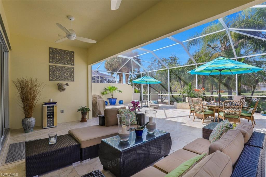 4080 Trinidad Way Naples, FL 34119 - Photo 20 of 35 a living room with patio furniture and a potted plant