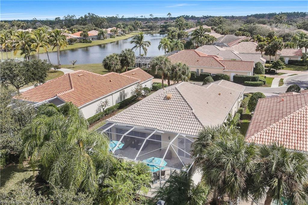 4080 Trinidad Way Naples, FL 34119 - Photo 23 of 35 an aerial view of house with yard and ocean view