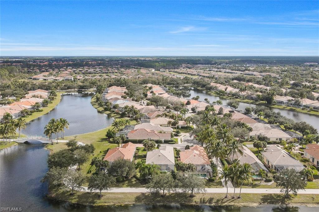 4080 Trinidad Way Naples, FL 34119 - Photo 25 of 35 an aerial view of residential building and lake