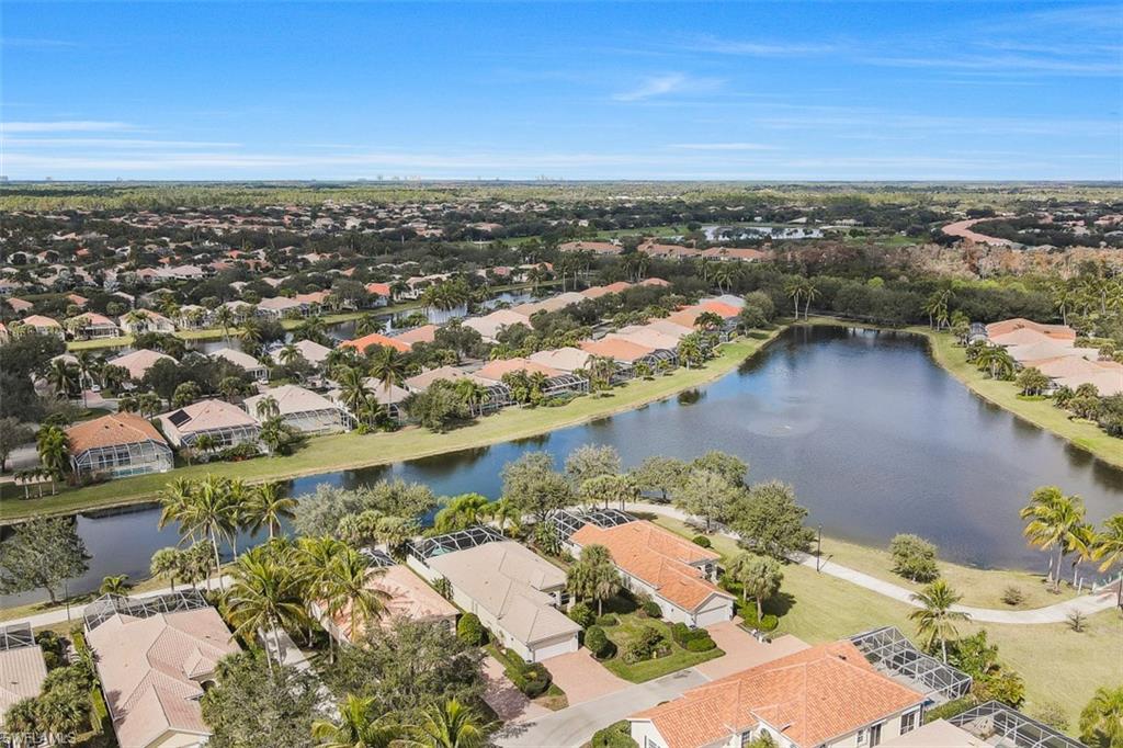 4080 Trinidad Way Naples, FL 34119 - Photo 26 of 35 an aerial view of a house with a lake view