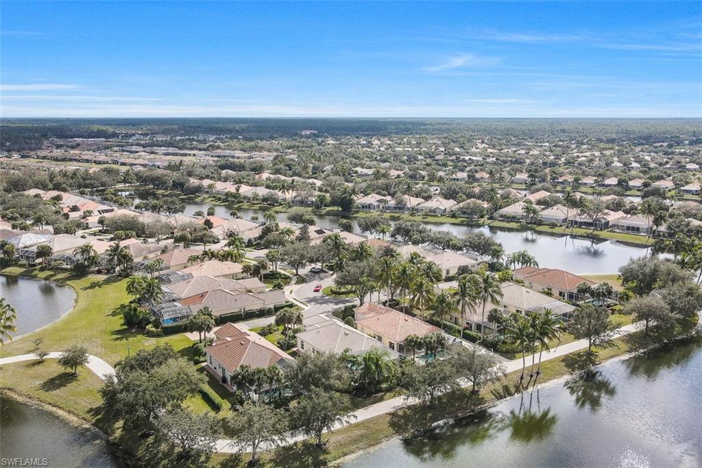 4080 Trinidad Way Naples, FL 34119 - Photo 34 of 35 an aerial view of residential building and lake