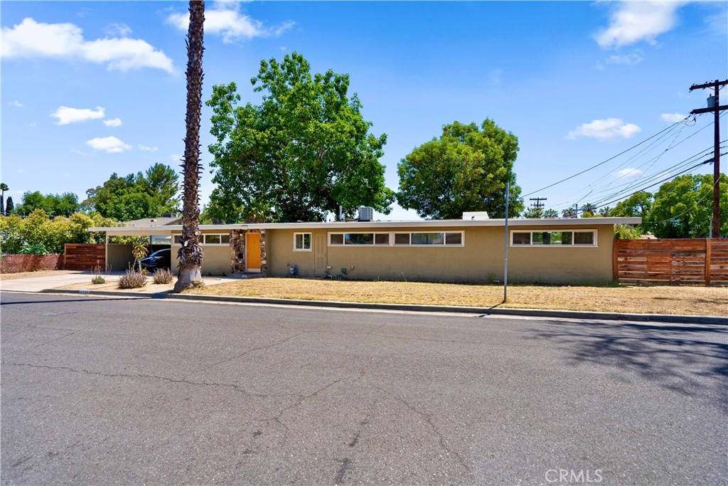 6788 Fig Street Riverside, CA 92506 - Photo 1 of 1 a view of swimming pool with seating area and trees in the background