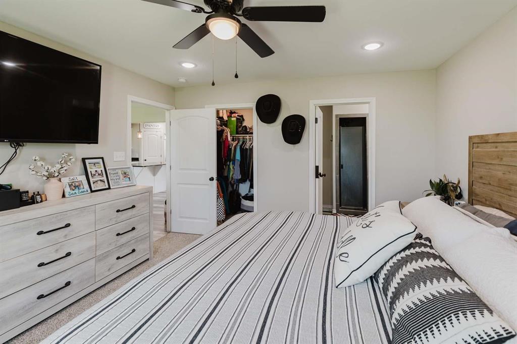 8615 North Fm 51 Decatur, TX 76234 - Photo 18 of 26 a bedroom with a bed and a flat screen tv