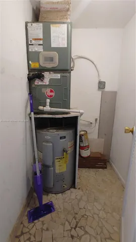 a white toilet sitting next to a bath tub