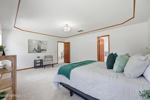 a bedroom with a bed furniture and window