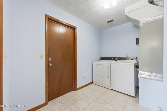 a view of a room with storage and utility room