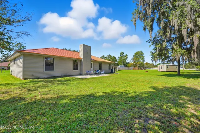 a view of a yard with swimming pool