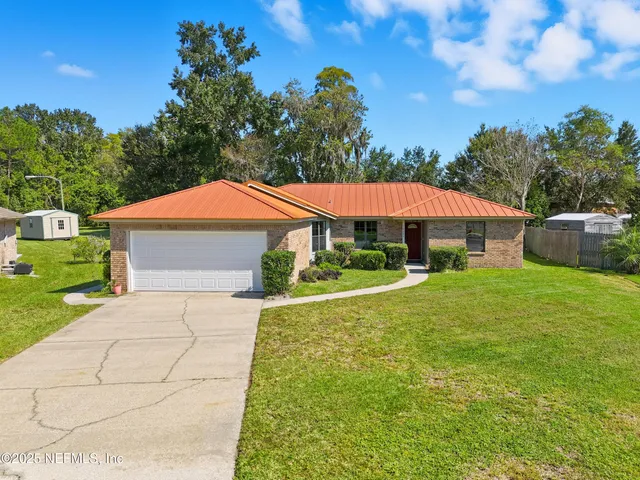 a front view of a house with yard