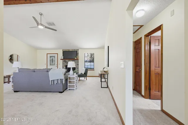 a living room with furniture and a table