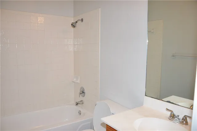 a bathroom with a bathtub and a toilet