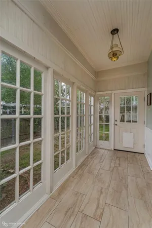 a view of empty room with windows