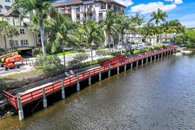 a view of a swimming pool with outdoor seating