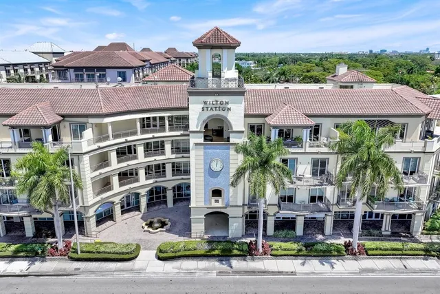 a front view of a building with garden