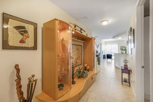 a view of a hallway with dining area