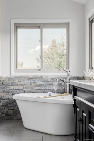 a bathroom with a bathtub and a sink