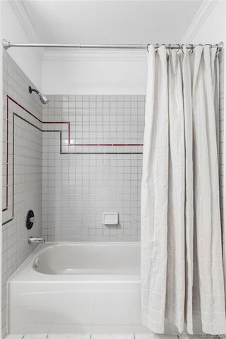 a bathroom with a shower and a bathtub