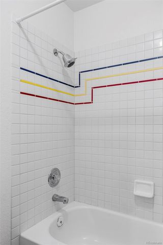 a bathroom with a shower and a bathtub